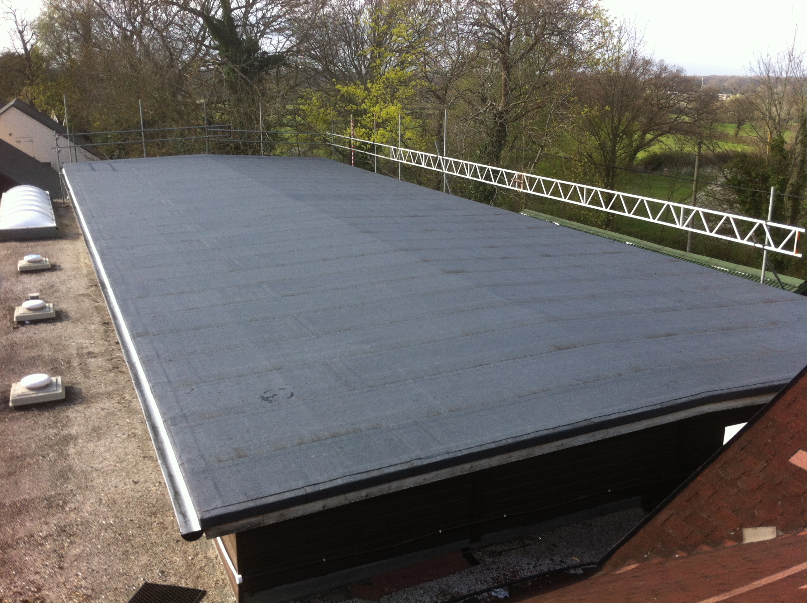 Completed EPDM flat roof — professional installation with proper drainage